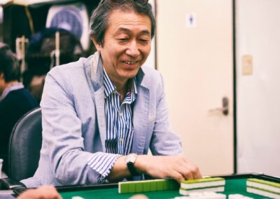 Senior man playing mahjong