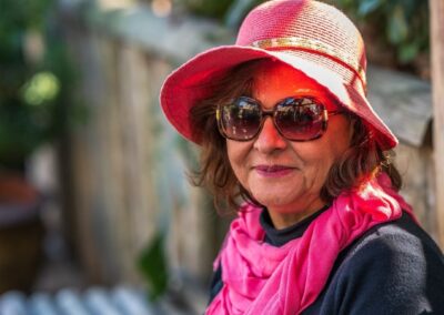 Senior woman smiling while sitting outside