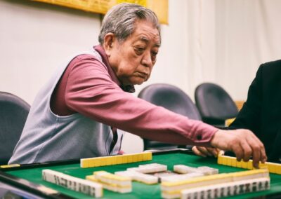 Senior man playing mahjong
