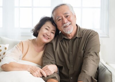 Smiling senior couple on couch