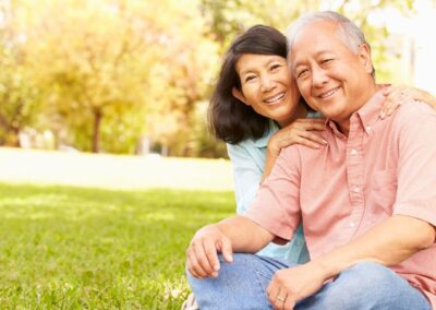 Senior couple smiling while in outdoor park