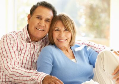 Smiling senior couple on couch
