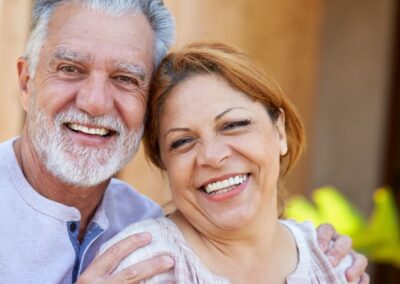 Senior couple smiling together while embracing