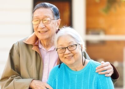 Senior couple smiling while on outdoor walk